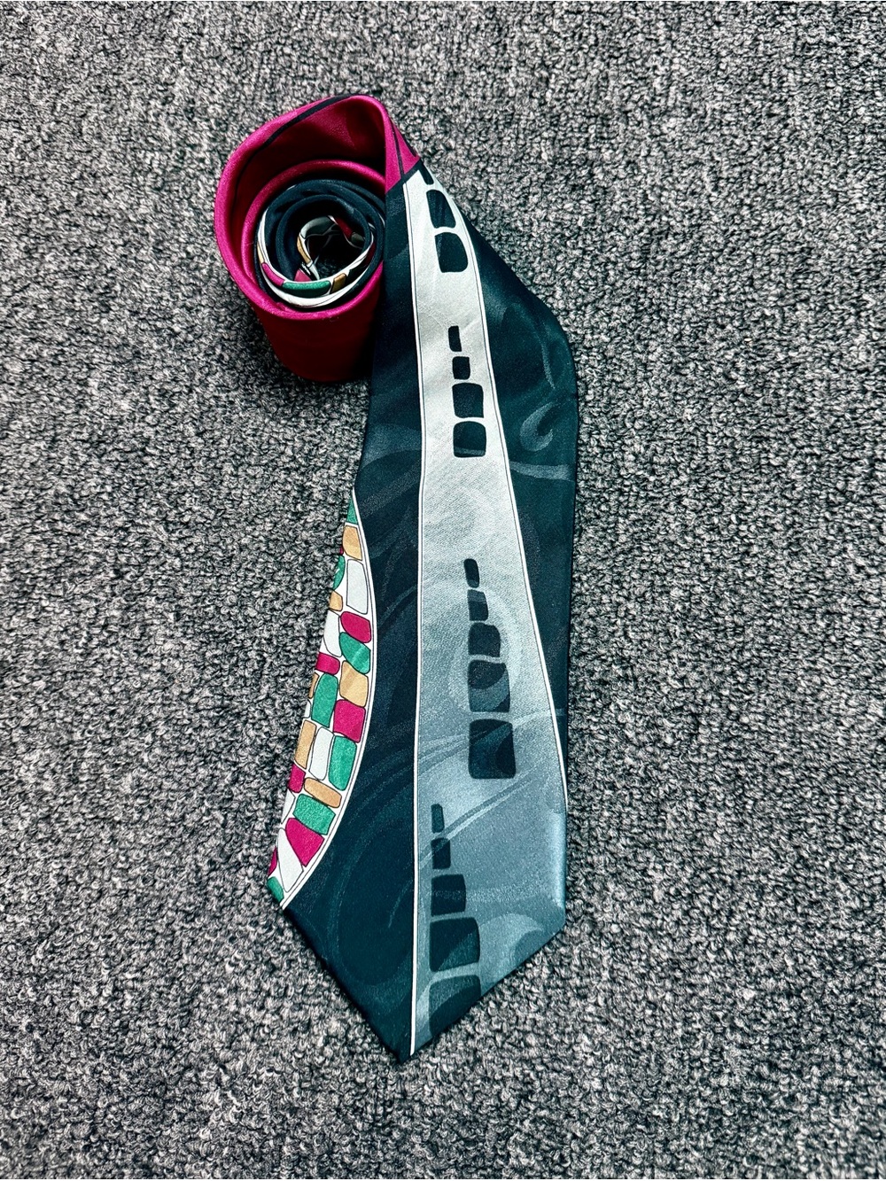 Bugle Boy Black Tie with Teal Logo and Multicolor Pattern